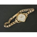 A ladies 9ct gold Omer mechanical watch, on a later 9ct gold bracelet by J A Mine