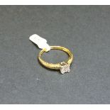 An 18ct gold four stone princess cut diamond square cluster ring