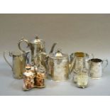 A late Victorian silver plated four piece tea and coffee service, a hot water jug, and two plated