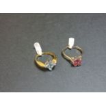 An 18ct gold single stone aquamarine ring, and an 18ct white gold single stone pink tourmaline ring