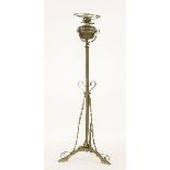 An Art Nouveau brass standard oil lamp, with a telescopic column, 133cm high