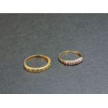 A diamond set half eternity ring, tested as approximately 18ct gold, and a 9ct gold ruby and diamond