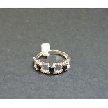 A 9ct white gold sapphire and diamond half hoop ring