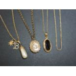 A 9ct gold smoky quartz pendant, an Edwardian gold fox tail chain marked 9ct, a simulated pearl gold