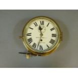 A thirty day brass ship's clock, J Blount Thomas & Co, Southampton, 25.5cm diameter