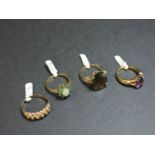 A 9ct gold single stone smokey quartz ring, a 9ct gold single stone amethyst ring, a 9ct gold opal
