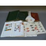 A collection of stamps, in seven albums and some loose