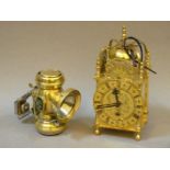 A reproduction brass carriage clock, and Zephyr brass oil bicycle lamp