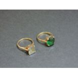 A 9ct gold synthetic blue spinel single stone ring, and a single stone synthetic green spinel ring