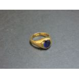 A gentleman's single stone synthetic sapphire gold ring, marked 18ct, finger size O LE
