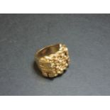A 9ct gold four row shot ring, with applied initial shoulders 'MC', 56.1g approximately