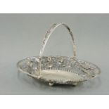 A silver basket, West & Son, Sheffield 1911, applied with fruiting vines and ears of wheat, 17oz,