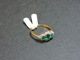 An 18ct gold synthetic emerald and diamond regal cluster ring