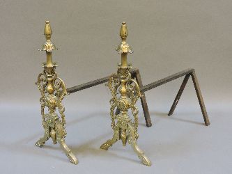 A pair of brass fire dogs, 41cm high