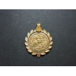 A half sovereign, dated 1910, in a 9ct gold pendant mount