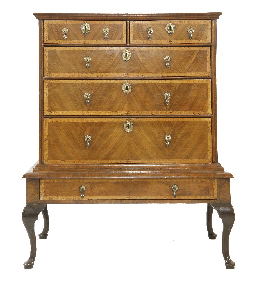 A walnut chest on stand,   early 18th century, on later cabriole legs, having two short and four