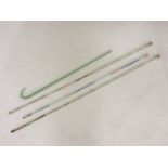 Three clear glass spiral twist Nailsea walking canes, filled with coloured beads, and another, 132.