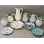Five Victorian moulded jugs, four in a pack, blue ground, a French porcelain plate, with