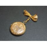 A back and front locket, on a gilt metal fob