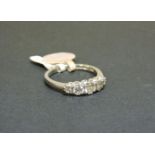 An 18ct white gold graduated five stone diamond ring