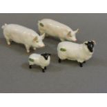 Two Beswick pigs and two sheep, CH Wall Champion Boy 53' and 'CH Wall Queen 48', three with green