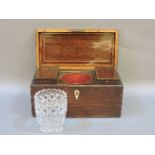 A 19th century mahogany tea caddy, with twin compartments, and centred with cut glass mixing