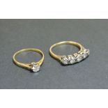 An 18ct gold single stone diamond ring, and a five stone diamond illusion set ring