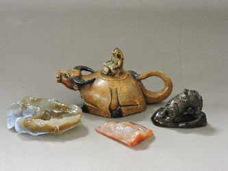 A jade brush washer, amber tiger, hardstone and soapstone buffalo, and rider teapot