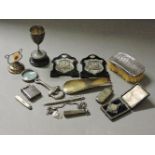 Various small silver items, including a cup, cigarette holder on chain, folding fruit knife, etc