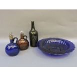 An antique bottle, with a medallion of a sheath of corn held by arms, 26cm, a Bristol blue decanter,