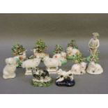A collection of 19th century Staffordshire pottery animal figures, including a spongeware cat, and a