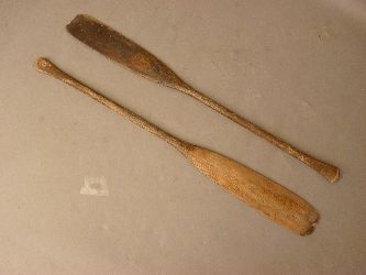 A pair of early 20th century wood canoe paddles, 132 and 133cm high
