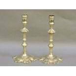 A pair of George III brass petal base candlesticks