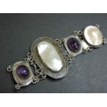 An Arts and Crafts silver blister pearl and amethyst bracelet, with alternating plaques, twisted