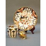 A Royal Crown Derby Imari patterned ginger jar, plate, and paperweight with gold stopper to base