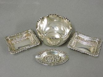 A pair of silver rectangular dishes, a silver bowl, and a silver ashtray inscribed ‘Royal