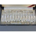 A set of twelve Chinese sterling 950 stamped spoons, each with different terminals, a kettle,