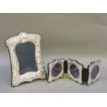 A triple silver photograph frame, and an ornate silver photograph frame