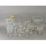 A collection of 19th century rummers and wine glasses, including etched and engraved glasses