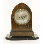 A Regency rosewood bracket clock, of lancet shape with strung and inlaid decoration, striking on a