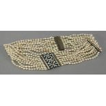 A silver simulated pearl and paste choker or dog collar, circa 1915, with a lattice centrepiece, set