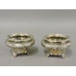 A pair of Victorian silver salts, possibly William Richards, London 1841, decorated with scrolls and