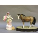 A Royal Doulton porcelain figure, 'Henley' HN 3367, and a Beswick horse