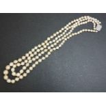 A two row graduated cultured pearl necklace, with a diamond set clasp