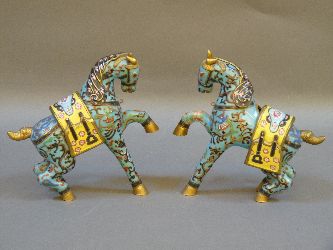 A pair of 20th century Chinese enamelled horses, both rearing, 19.5cm high