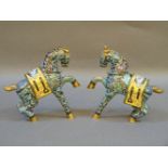 A pair of 20th century Chinese enamelled horses, both rearing, 19.5cm high