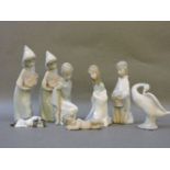 A Lladro nativity scene, two young girls with cockerels, a goose, and a recumbent dog