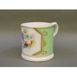 A Rockingham mug, white ground with hand painted floral decoration and gilt rim