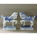 A pair of Dutch tin glazed horse ornaments