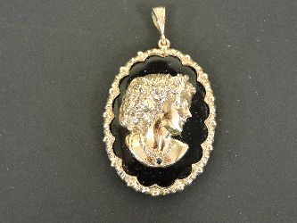 A 9ct gold diamond set onyx cameo pendant, set with diamonds